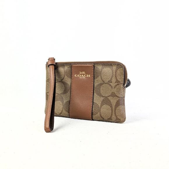 Coach Handbags - NWOT Coach Corner Zip Wristlet in Signature Coated Canvas